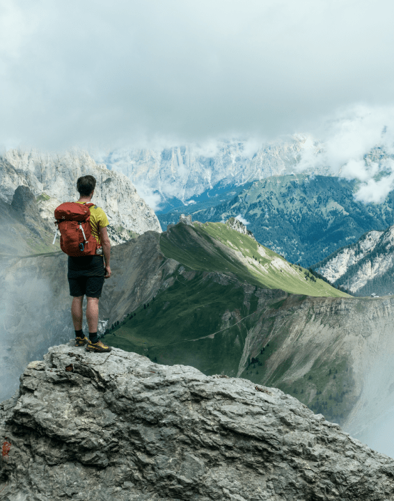 a man on a mountain peak
